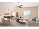 Spacious game room with pool table, comfortable seating, and ceiling fans at 18774 N Ibis Way, Maricopa, AZ 85138