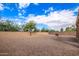 Landscaped backyard with gravel and block wall at 18774 N Ibis Way, Maricopa, AZ 85138