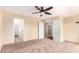 Spacious bedroom with neutral carpeting and ample closet space at 18774 N Ibis Way, Maricopa, AZ 85138