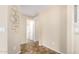Clean hallway with tiled floors and bathroom access at 18774 N Ibis Way, Maricopa, AZ 85138