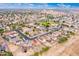 Aerial view of residential neighborhood with houses and streets at 18774 N Ibis Way, Maricopa, AZ 85138
