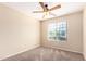 Well-lit bedroom with ceiling fan and window coverings at 18774 N Ibis Way, Maricopa, AZ 85138