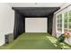 Home golf simulator room with artificial turf and large projection screen at 5330 N Palo Cristi Rd, Paradise Valley, AZ 85253