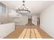 Elegant dining room with tile floors and a large chandelier at 9827 W Keyser Dr, Peoria, AZ 85383