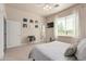 Bright bedroom with ensuite bathroom access and window seating at 8052 E Mcdowell Rd, Mesa, AZ 85207