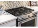 Stainless steel gas cooktop with modern controls and integrated oven at 23228 N Gaviota Dr, Sun City West, AZ 85375
