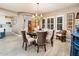 Bright dining area with a round table and kitchen view at 23228 N Gaviota Dr, Sun City West, AZ 85375