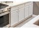 White shaker-style kitchen cabinets offering plenty of storage at 23228 N Gaviota Dr, Sun City West, AZ 85375