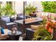 Relaxing patio with fire pit and comfortable wicker furniture at 23228 N Gaviota Dr, Sun City West, AZ 85375