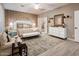 Luxurious main bedroom with king bed and neutral decor at 23228 N Gaviota Dr, Sun City West, AZ 85375