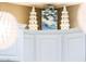 White kitchen cabinets with decorative accents and ample storage space at 23228 N Gaviota Dr, Sun City West, AZ 85375