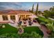 Relaxing backyard with patio, fire pit, and artificial turf at 23228 N Gaviota Dr, Sun City West, AZ 85375