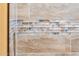 Bathroom with beige tile and decorative glass tile accents at 23228 N Gaviota Dr, Sun City West, AZ 85375