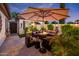 Outdoor patio with fire pit, seating area, and string lights at 23228 N Gaviota Dr, Sun City West, AZ 85375