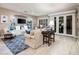 Spacious living room with comfortable seating and built-in shelving at 23228 N Gaviota Dr, Sun City West, AZ 85375
