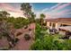 Landscaped backyard with a patio and desert landscaping at 23228 N Gaviota Dr, Sun City West, AZ 85375