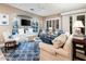 Light and airy living room with built-in shelving and comfortable seating at 23228 N Gaviota Dr, Sun City West, AZ 85375