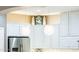 Modern kitchen with white cabinets and stainless steel appliances at 23228 N Gaviota Dr, Sun City West, AZ 85375