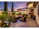 Outdoor patio with fire pit, seating area, and string lights at 23228 N Gaviota Dr, Sun City West, AZ 85375