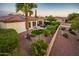 Landscaped backyard with patio and artificial turf at 23228 N Gaviota Dr, Sun City West, AZ 85375
