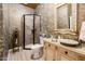 Elegant bathroom with a walk-in shower, vessel sink, and ornate mirror at 23228 N Gaviota Dr, Sun City West, AZ 85375
