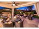Covered patio with dining area and built-in grill at 23228 N Gaviota Dr, Sun City West, AZ 85375