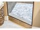 A shower with a pebble stone floor and modern design at 23228 N Gaviota Dr, Sun City West, AZ 85375