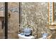 Spa-like bathroom with decorative wallpaper and blue and white accents at 23228 N Gaviota Dr, Sun City West, AZ 85375