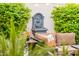 Charming patio with fountain and lush greenery creates a serene atmosphere at 23228 N Gaviota Dr, Sun City West, AZ 85375