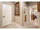 Home hallway featuring a framed picture and an open bar at 23228 N Gaviota Dr, Sun City West, AZ 85375