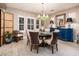 Elegant dining room featuring a round table and blue buffet at 23228 N Gaviota Dr, Sun City West, AZ 85375