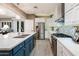 Modern kitchen with white cabinets, stainless steel appliances, and a large island at 23228 N Gaviota Dr, Sun City West, AZ 85375