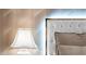 Close-up of a luxurious bed headboard with accent lighting and pillows at 23228 N Gaviota Dr, Sun City West, AZ 85375