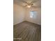 Well-lit bedroom featuring wood-look floors and ceiling fan at 7003 W Laurel Ln, Peoria, AZ 85345