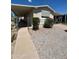 Single-wide manufactured home with carport and walkway at 245 S 56Th St # 209, Mesa, AZ 85206