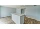 Modern kitchen with white cabinets, quartz countertops and island at 3823 W Augusta Ave, Phoenix, AZ 85051