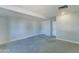 Spacious finished basement with neutral walls and concrete floors at 3823 W Augusta Ave, Phoenix, AZ 85051