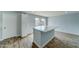 Modern kitchen with white cabinets and a large island at 3823 W Augusta Ave, Phoenix, AZ 85051