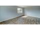 Spacious bedroom with wood-look floors and a window at 3823 W Augusta Ave, Phoenix, AZ 85051