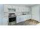 Updated kitchen featuring white shaker cabinets and marble countertops at 3823 W Augusta Ave, Phoenix, AZ 85051