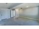 Clean and bright basement area with access to other rooms at 3823 W Augusta Ave, Phoenix, AZ 85051
