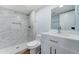 Modern bathroom with marble shower and white vanity at 3823 W Augusta Ave, Phoenix, AZ 85051