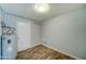Bright laundry room with vinyl flooring and a water heater at 3823 W Augusta Ave, Phoenix, AZ 85051