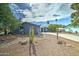Ranch style home with desert landscaping and a large driveway at 3823 W Augusta Ave, Phoenix, AZ 85051
