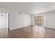 Living room with wood-look tile floor and sliding glass door at 1920 W Lindner Ave # 137, Mesa, AZ 85202