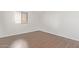 Spacious bedroom with wood-look floors and large window at 1920 W Lindner Ave # 137, Mesa, AZ 85202