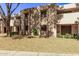 Building exterior with landscaping and a tree in front at 1920 W Lindner Ave # 137, Mesa, AZ 85202