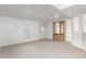 Open living area with built-in shelving and carpeted floors at 205 S Higley Rd # 288, Mesa, AZ 85206