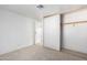 Simple bedroom with neutral walls, carpeting, and large closet at 205 S Higley Rd # 288, Mesa, AZ 85206