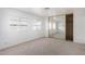 Bright bedroom with mirrored closet doors and neutral carpeting at 205 S Higley Rd # 288, Mesa, AZ 85206